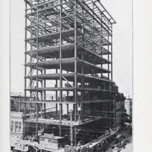 Image 2: Union Bank Tower in early construction phases with people walking in front on the sidewalks.