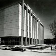 Image 1: Facade of the Monarch Life Building viewed from across Hargrave Street with vintage cars parked on the side street