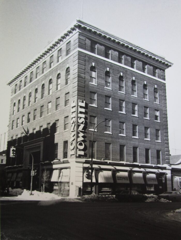 The Travellers Building with “TOWNSITE” written vertically on both sides of the front corner of the building.