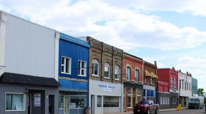 Main Street in Carberry with two trucks parked. The Modern Bakery building is seen in the middle.