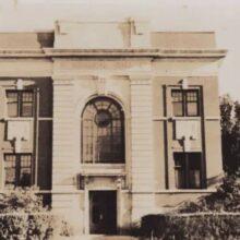 Archival photo of arched window above Memorial Hall entrance