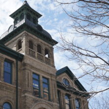 Image 2: Looking up at school tower and steeple