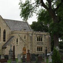 Image 7: Facade of St John's Cathedral with multiple grace markings in view on the grass in front of the building