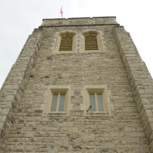 Image 5: Looking up at one of the stone faced facades of St. John's Cathedral showing 4 windows