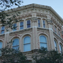 Image 1: Looking up at the facade of the Telegram Building from the corner of Albert Street an McDermot Avenue