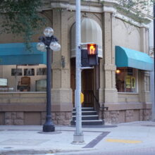 Image 3: Entrance of the Telegram Building at the corner of Albert and McDermot from street level