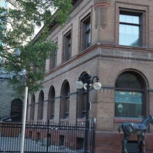 Image 2: North and east facing facades of the building from street view on the McDermot side