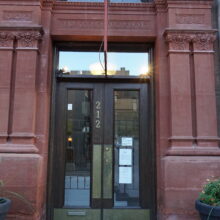 Image 5: Dark stained wooden framed front door with glass panes