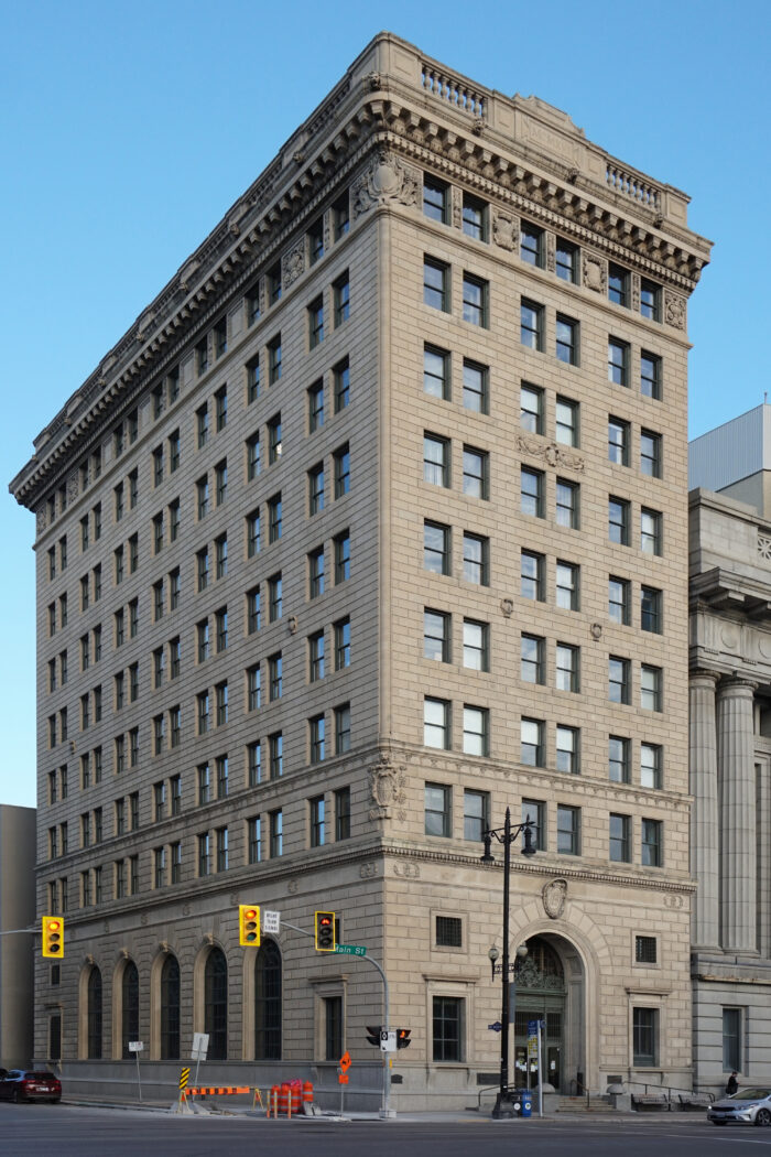 Winnipeg’s Bank of Hamilton as seen from across the street. A streetlight and stoplight are in front.