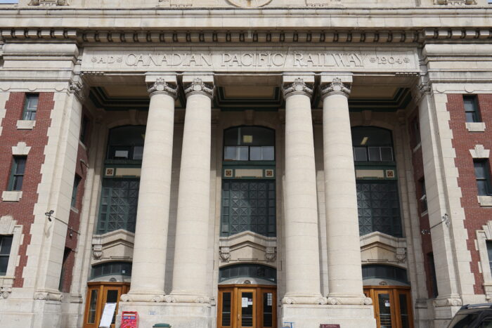 The front entrance of Winnipeg’s Canadian Pacific Railway Station with “AD CANADIAN PACIFIC RAILWAY 1904” carved in stone above.