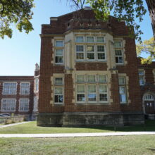 Image 7: First and second floor windows at front of building extension along front of school