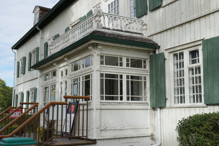 The front entrance of the St. Boniface Museum. Signage and planers are at the top of the steps.