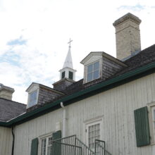 Image 2: Roof of the St. Boniface Museum featuring 2 dormer windows and a chimney