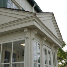 Image 7: Enclosed entrance into St. Boniface Museum featuring a pediment above the door