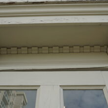 Image 9: Close up view of architectural details featuring decorative brackets