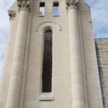 Image 9: Portion of the facade of the St Boniface Cathedral featuring decorative columns and empty arched windows