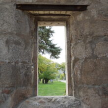 Image 12: A view through an empty window looking out from a portion of the original St Boniface Cathedral