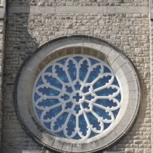 Image 5: Rose window detail on the facade of the building