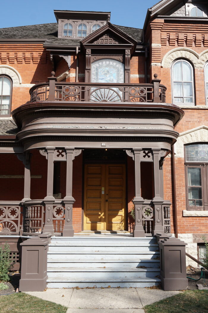 Front stairs leading to wooden doors entrance of Dalnavert