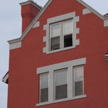 Image 5: Architectural details of the building featuring one of the dormer windows