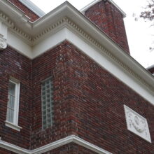 Image 3: Decorative architectural detail of the Moss House with the cornices in view