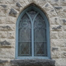 Image 4: Intricate details on glass paned windows on the facade of St. Luke's Church