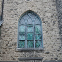 Image 5: Intricate details on glass paned windows on the facade of St. Luke's Church