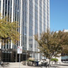 Image 1: The facade of the Norquay Building viewed from an angle at street level on York Avenue