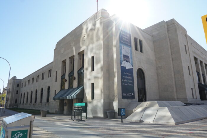 Winnipeg’s Civic Auditorium building. Signage is visible in front of and on the side of the building.