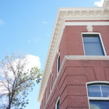 Image 2: Looking up at two windows on the second floor of the Selkirk Post Office.