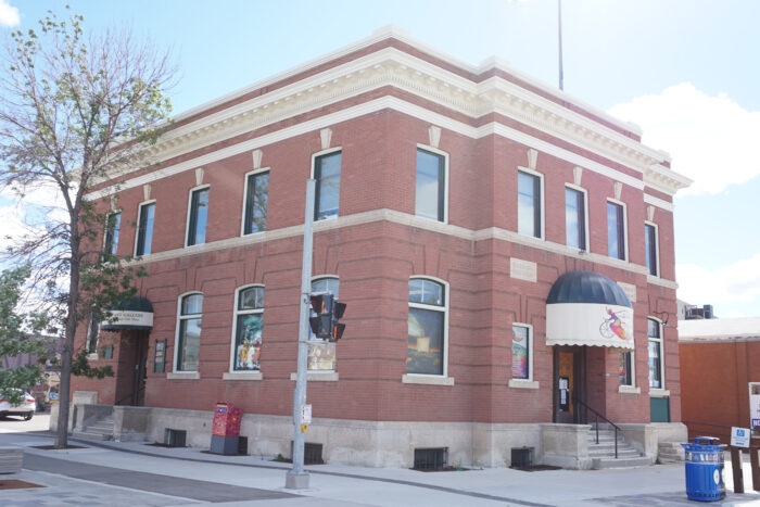 The Selkirk Post Office building with a tree obscuring part of the facade.