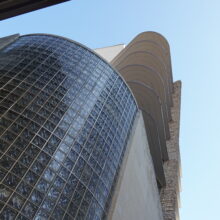 Image 1: Looking up the Winnipeg Clinic from the corner of St Mary Avenue and Vaughn Street featuring glass architectural details