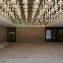 Image 5: Covered space near the main entrance of the Winnipeg Art Gallery facing Memorial Boulevard featuring lighting above