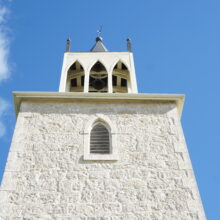 Image 4: Looking up at top of church steeple with 3 arched openings.