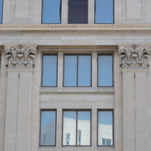 Image 2: Ornate pilaster details flanking windows on the facade of the Hudson's Bay Building