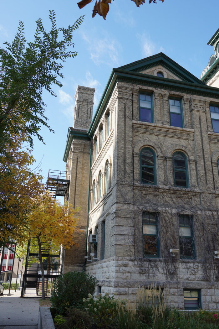 Side of Isbister School with stone chimney