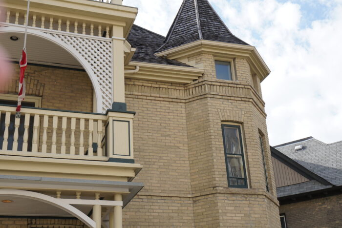 The second and third storey of the corner tower of Benard House. Part of the second storey of the porch is visible.