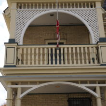 Image 1: The 2nd storey balcony of the Benard House.