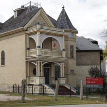 Image 6: Benard House with a for sale sign in the front yard.