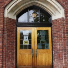 Image 2: The front wooden door of the Wolseley School building