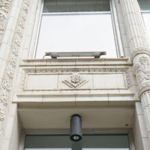 Image 3: Looking up at the front facade of the Inglis Building.