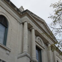 Image 2: Second floor window above entrance with twin columns on either side