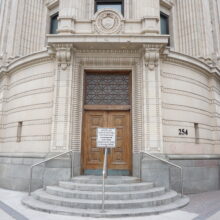 Image 3: Original main entrance of Looking up at the facade of Bank of Nova Scotia building.