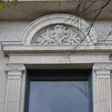 Image 6: Ornate half-circle above upper floor window