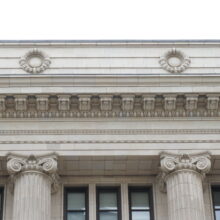 Image 5: Two ornate medallions above cornice