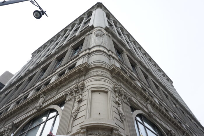 Looking up the corner facade of the Paris Building from street level at the corner of Hargrave Street and Portage Avenue