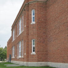 Image 3: Two long slit windows along side of school