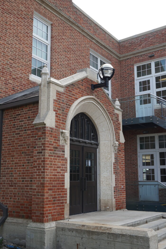 An entrance to MacKenzie School with a light fixture projecting above.