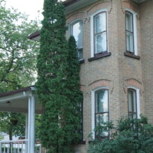 Image 4: Corner facade of house with tree