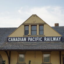 Image 1: Three window dormer above CPR station